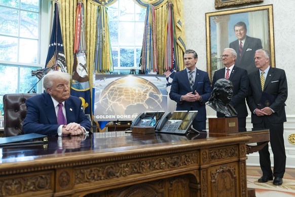 epa12120840 US Secretary of Defense Pete Hegseth (2-L), participates in an announcement by US President Donald J Trump (L) about moving forward with the Golden Dome missile defense shield, in the Oval ...