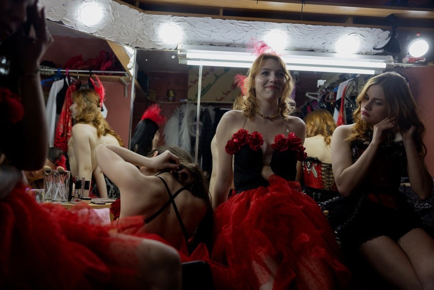 Lisa, 20 (C) and strip club dancers prepare for a performance in a dressing room at the strip club &quot;Flash Dancers&quot; in Kharkiv on May 15, 2025, amid the Russian invasion in Ukraine. Since Rus ...
