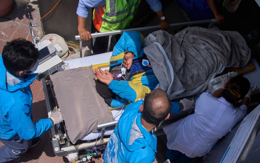 Medics take Dawa Sherpa, a mountain guide who had been missing for several days in the Everest region, for treatment after he arrived at HAMS Hospital in Kathmandu, Nepal, Thursday, June 4, 2026. (AP  ...