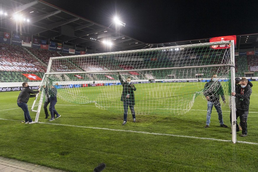 Staff members mount a replacement goal, after the original one was found to be deficient ahead of the FIFA World Cup Qatar 2022 qualifying Group C soccer match between Switzerland and Lithuania, at th ...