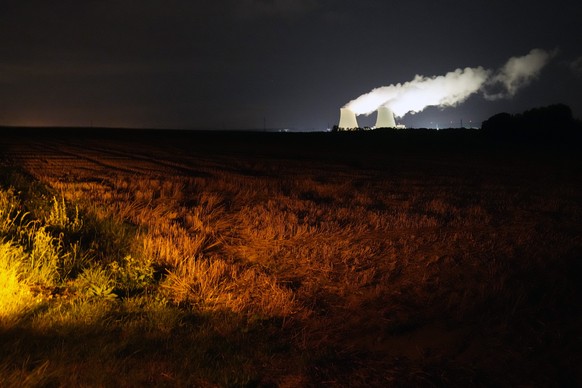 FILE - Steam escape during the night from the nuclear plant of Nogent sur Seine, 110 kms south east of Paris, Sunday, Aug. 8, 2021. France&#039;s minister for energy transition said Friday Sept.2, 202 ...