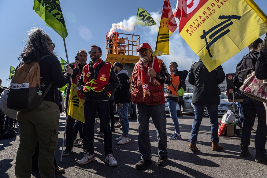 epa10581723 Railway workers gather before taking action against the government pension reform at &amp;#x2018;Gare de Lyon&#039; train station in Paris, France, 20 April 2023. France faces an ongoing n ...