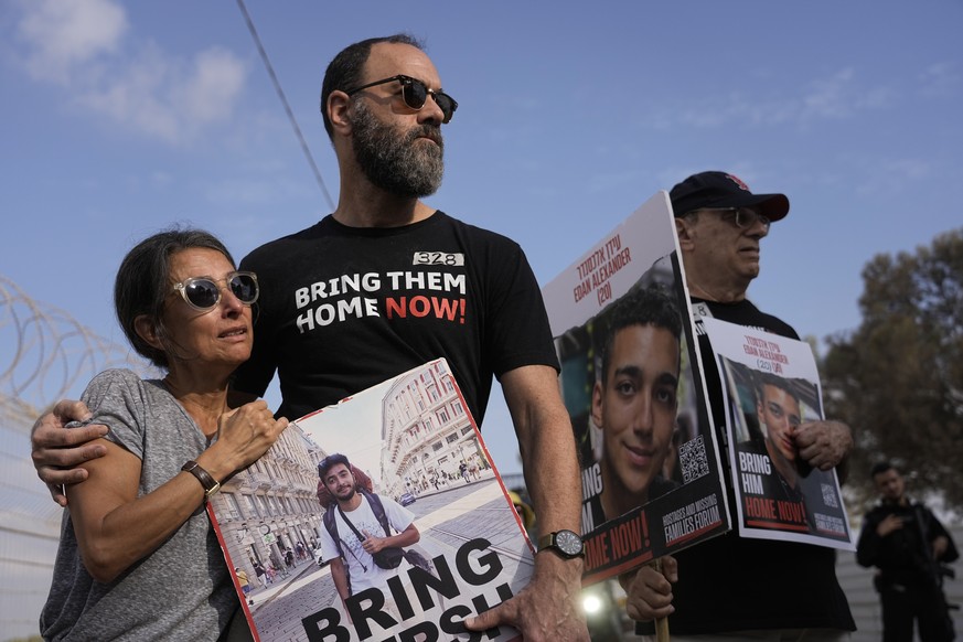 FILE - Rachel Goldberg, left, and Jon Polin center, parents of Israeli-American hostage Hersh Goldberg-Polin, along with other relatives of hostages held in the Gaza Strip by the Hamas militant group ...