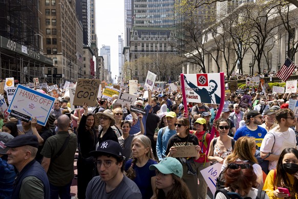 epa12041451 People participate in a rally and march as part of a national day of protest again the policies of the Trump administration in New York, New York, USA, 19 April 2025. EPA/JUSTIN LANE