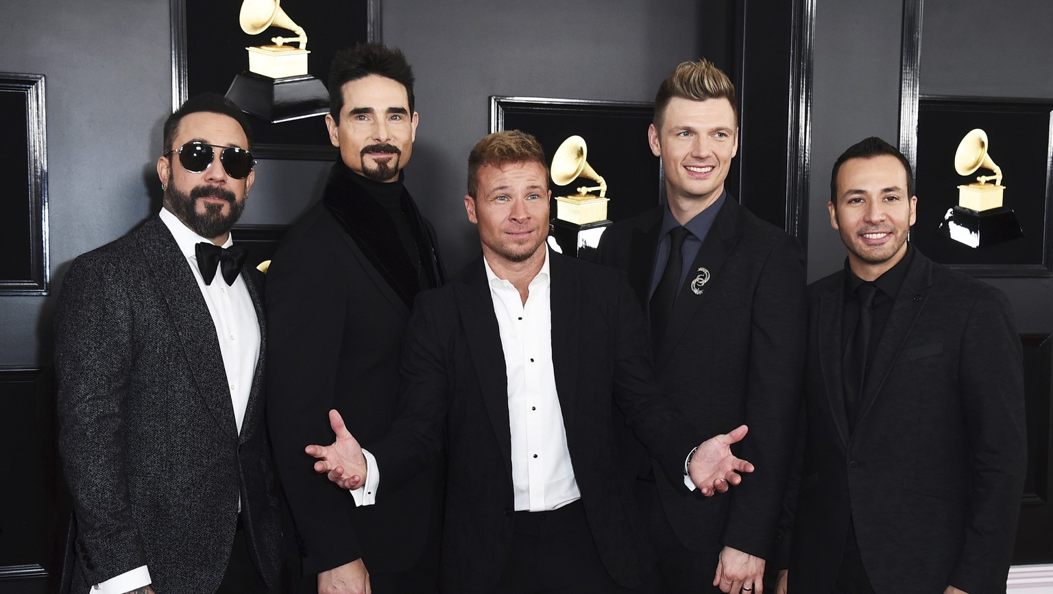 FILE - AJ McLean, from left, Kevin Richardson, Brian Littrell, Nick Carter, and Howie Dorough of The Backstreet Boys appear at the 61st annual Grammy Awards in Los Angeles on Feb. 10, 2019. The pionee ...