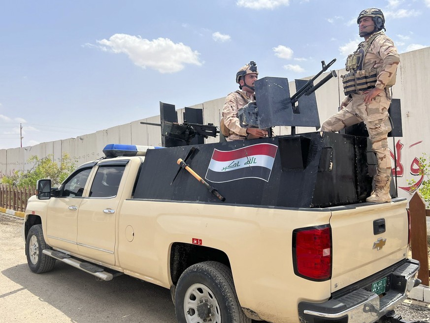 Iraqi soldiers stand on a truck ion a base in Sinjar, Iraq, Tuesday, May 3, 2022. Iraq&#039;s military launched an offensive in Sinjar district on Sunday to clear out armed elements of the YBS, a loca ...