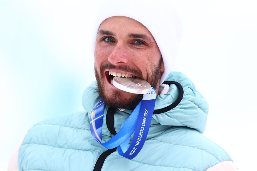 epa12757630 Silver medalist Nikita Filippov of Russia reacts during the victory ceremony for the Men's Sprint of the Ski Mountaineering competitions at the Milano Cortina 2026 Winter Olympic Game ...