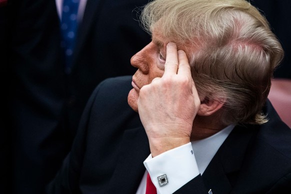 WASHINGTON, DC - JANUARY 4 : President Donald J. Trump listens during a signing ceremony for S. 756, First Step Act and H.R. 6964, Juvenile Justice Reform Act in the Oval Office at the White House on  ...