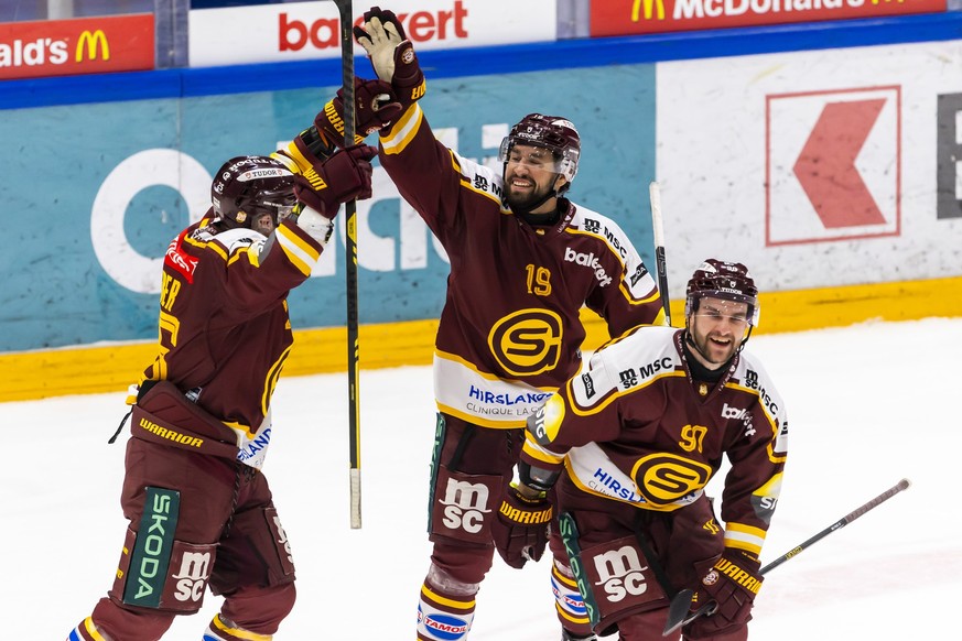 Simon Le Coultre (GSHC) #90 celebrates his goal with his teammates Roger Karrer (GSHC), left, and Josh Jooris (GSHC), right, after scoring the 4:0, during a National League regular season game of the  ...