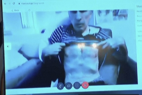 In this image made from video, Georgia&#039;s imprisoned former president Mikheil Saakashvili attends a court hearing from hospital via video link in Tbilisi, Monday, July 3, 2023. Saakashvili appeare ...