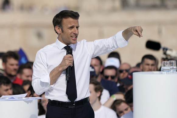 French President and centrist candidate Emmanuel Macron speaks during a campaign rally, Saturday, April 16, 2022 in Marseille, southern France. Far-right leader Marine Le Pen is trying to unseat centr ...