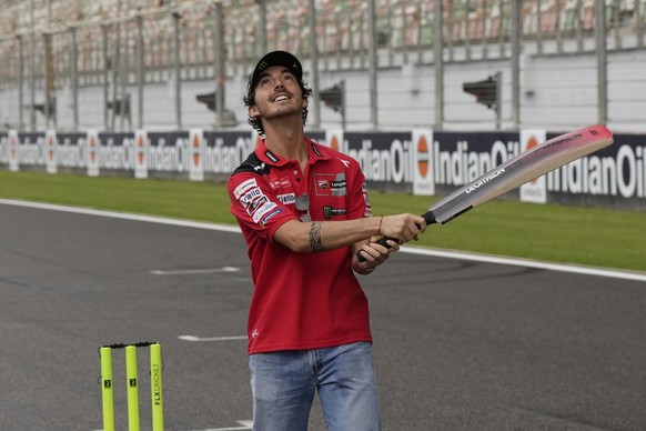 Ducati Lenovo Team member Francesco Bagnaia of Italy plays cricket ahead of Moto GP Bharat at the Buddh International Circuit in Greater Noida, outskirts of New Delhi, India, Thursday, Sept. 21, 2023. ...