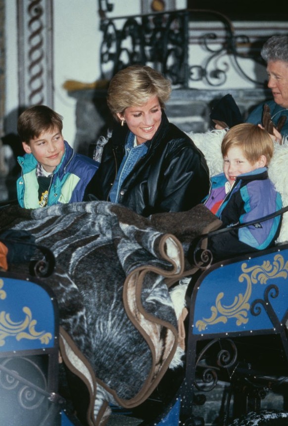 Diana, Princess of Wales (1961 - 1997) riding in a traditional sleigh with Prince William and Prince Harry during a skiing holiday in Lech, Austria, 30th March 1993. (Photo by Jayne Fincher/Princess D ...