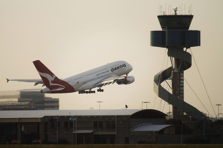 A Qantas A380 superjumbo takes off past the Air Traffic Control tower at Mascot Airport in Sydney on Saturday Nov. 27, 2010. The superjumbo took off from Sydney on Saturday on the first A380 passenger ...