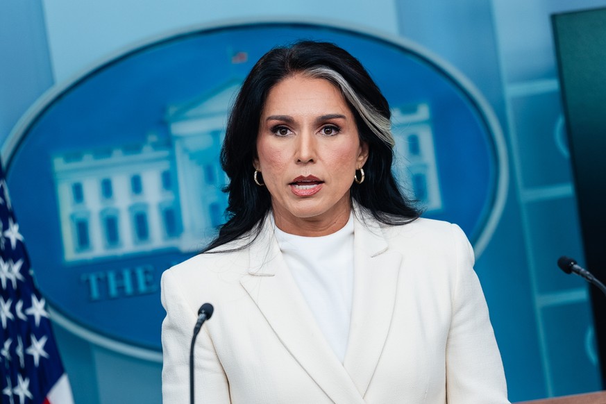epa12256722 Director of National Intelligence Tulsi Gabbard speaks during a news conference in the James S. Brady Press Briefing Room of the White House in Washington, DC, USA, 23 July 2025. Tensions  ...