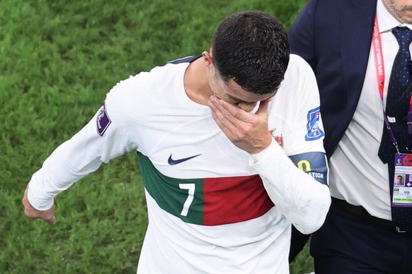 epa10359616 Cristiano Ronaldo of Portugal reacts as he leaves the pitch after the FIFA World Cup 2022 quarter final soccer match between Morocco and Portugal at Al Thumama Stadium in Doha, Qatar, 10 D ...