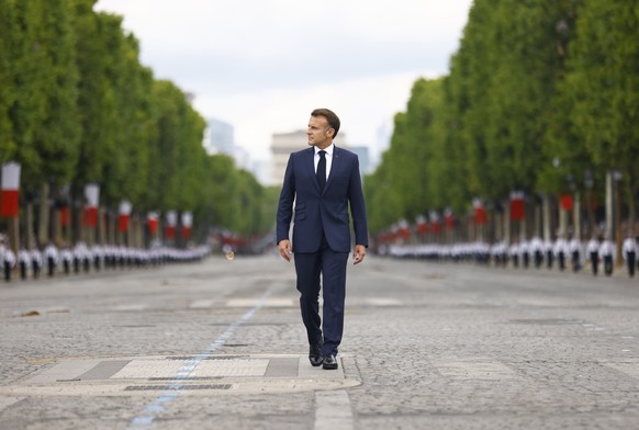 KEYPIX - epa12237112 French President Emmanuel Macron arrives to the annual Bastille Day military parade during the Bastille day celebrations in Paris, France, 14 July 2025. France celebrates its nati ...