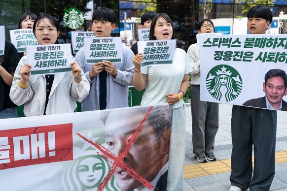 Protest Against Starbucks Korea In Seoul. Protesters hold placards and chant slogans such as Boycott Starbucks and resignation of Chung Yong-jin in front of the Starbucks Korea headquarters in Seoul,  ...