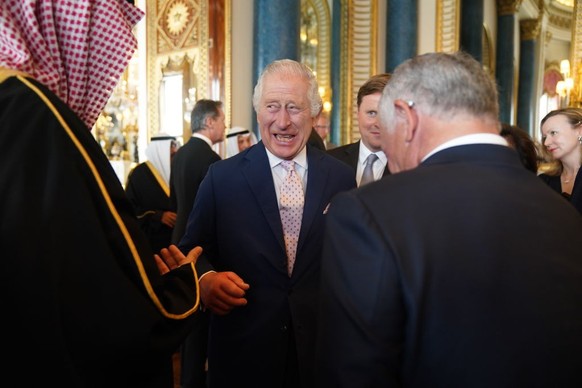 LONDON, ENGLAND - MAY 5: King Charles III speaks to guests during a reception at Buckingham Palace for overseas guests attending his coronation on May 5, 2023 in London, England. (Photo by Jacob King  ...