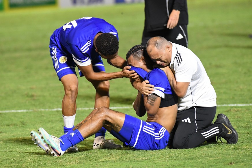 Curacao players celebrate qualifying for the 2026 FIFA World Cup after their game with Jamaica in Kingston, Jamaica, Tuesday, Nov. 18, 2025. (AP Photo/Collin Reid)