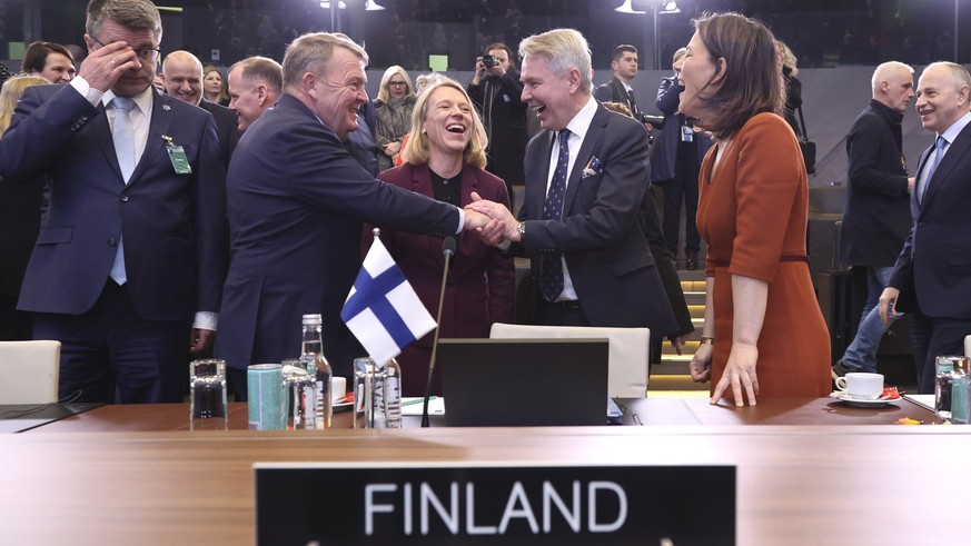 Denmark&#039;s Foreign Minister Lars Lokke Rasmussen, center left, shakes hands with Finland&#039;s Foreign Minister Pekka Haavisto as they attend the NATO-Ukraine Commission during a meeting of NATO  ...