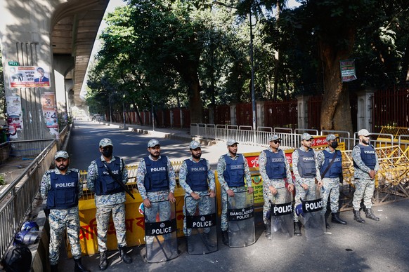 Policemen stand guard outside International Crimes Tribunal after security has been beefed up across the country ahead of an expected verdict against ousted Prime Minister Sheikh Hasina, in Dhaka, Ban ...
