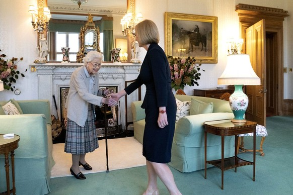 Britain's Queen Elizabeth II, left, welcomes Liz Truss during an audience at Balmoral, Scotland, where she invited the newly elected leader of the Conservative party to become Prime Minister and ...
