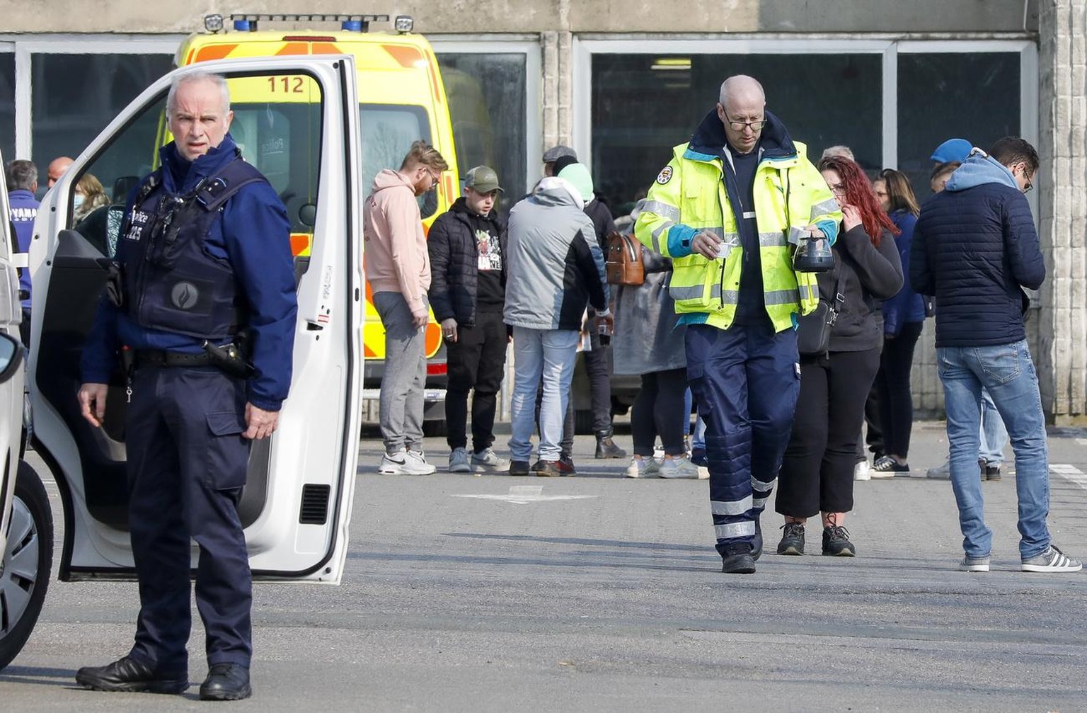 epa09837570 A police officer stands guard at the cordoned off scene in Strepy Bracquegnies, Belgium, 20 March 2022. Six people lost their lives and 26 were injured in the morning, when a car rammed in ...