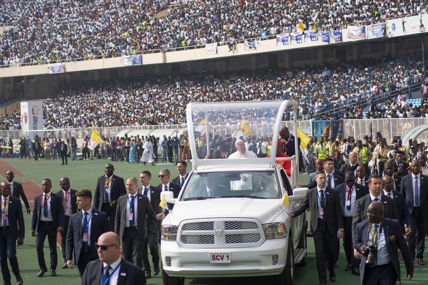 Pope Francis on the popemobile, waves at worshipers at the Martyrs? Stadium in Kinshasa, Congo, Thursday Feb. 2, 2023. Pope Francis urged Congo?s young people to work for a peaceful and honest future  ...