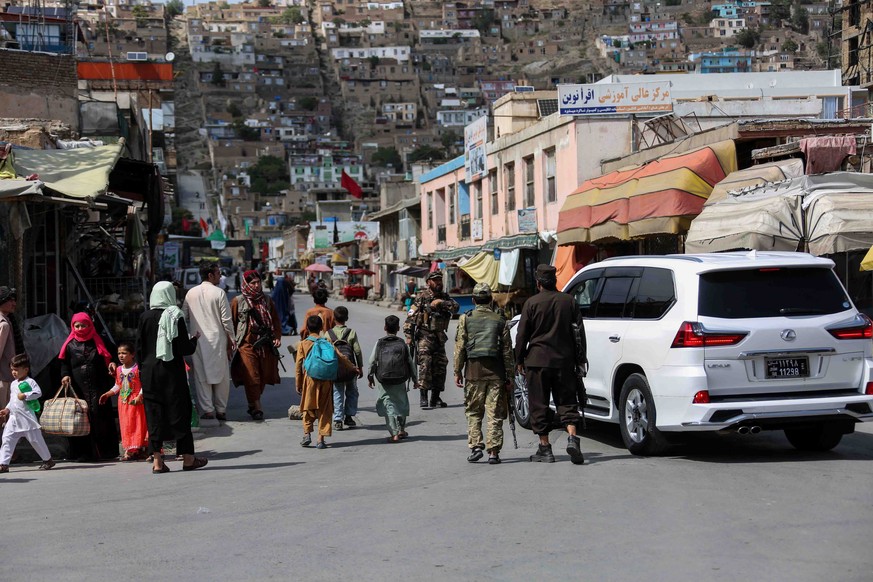 epa10104243 Taliban stand guard near the scene of an operation against the IS militants in Kabul, Afghanistan, 03 August 2022. Gunmen have engaged in clashes with Taliban security forces in the Karta- ...