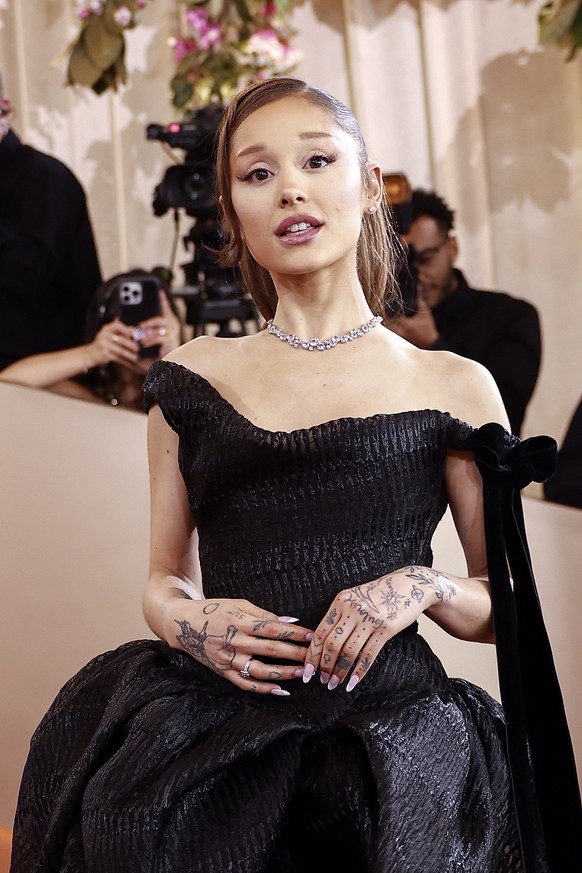 epa12643663 US singer Ariana Grande arrives for the 83rd annual Golden Globe Awards ceremony at the Beverly Hilton Hotel in Beverly Hills, California, USA, 11 January 2026. The Golden Globe Awards rec ...