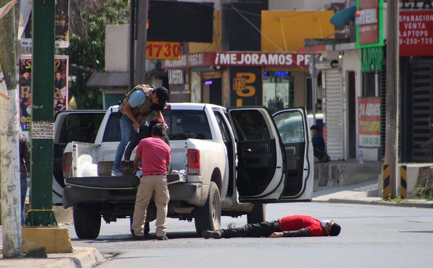 epa10543250 Experts from the Tamaulipas State Prosecutor&#039;s Office (FGJT) recreate the kidnapping of four US citizens, in the area where they were attacked in the city of Matamoros, Mexico, 25 Mar ...