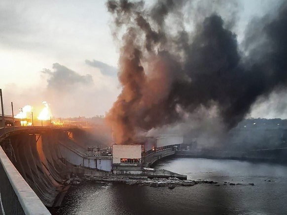 In this photo provided by Telegram Channel of Ukraine&#039;s Prime Minister Denys Shmyhal, smoke and fire rise over the Dnipro hydroelectric power plant after Russian attacks in Dnipro, Ukraine, Frida ...
