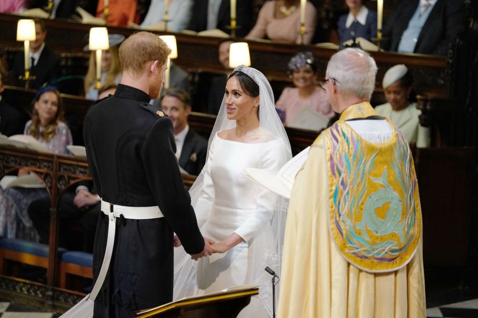 WINDSOR, UNITED KINGDOM - MAY 19: Prince Harry and Meghan Markle during their wedding service, conducted by the Archbishop of Canterbury Justin Welby in St George&#039;s Chapel at Windsor Castle on Ma ...