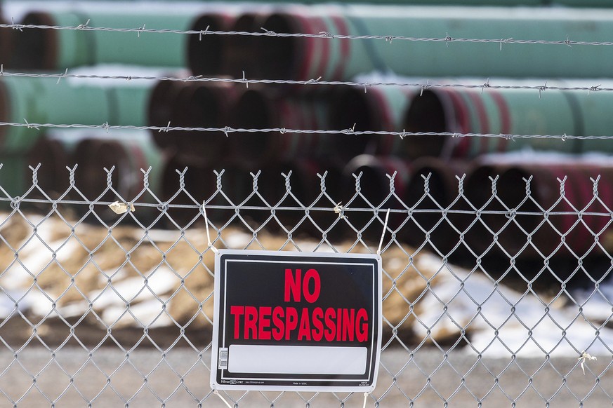 FILE - In this Dec. 18, 2020, file photo, pipes to be used for the Keystone XL pipeline are stored in a field near Dorchester, Neb. Calgary-based TC Energy, sponsor of the Keystone XL crude oil pipeli ...