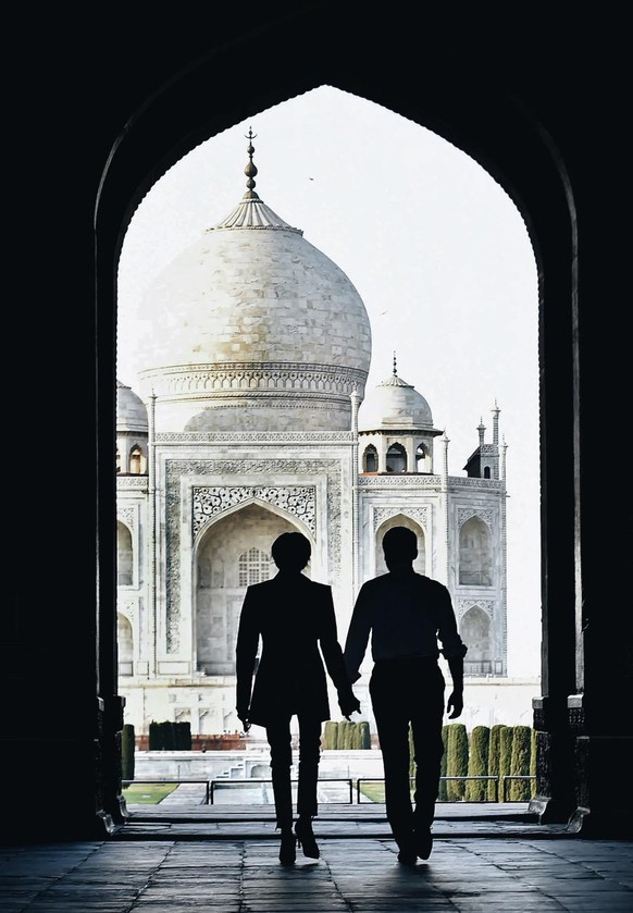 French President Emmanuel with wife Brigitte admire the Taj Mahal during their visit in Agra, India, Sunday, March 11, 2018.(Atul Yadav/Press Trust of India via AP) Processed with VSCO with a6 preset
