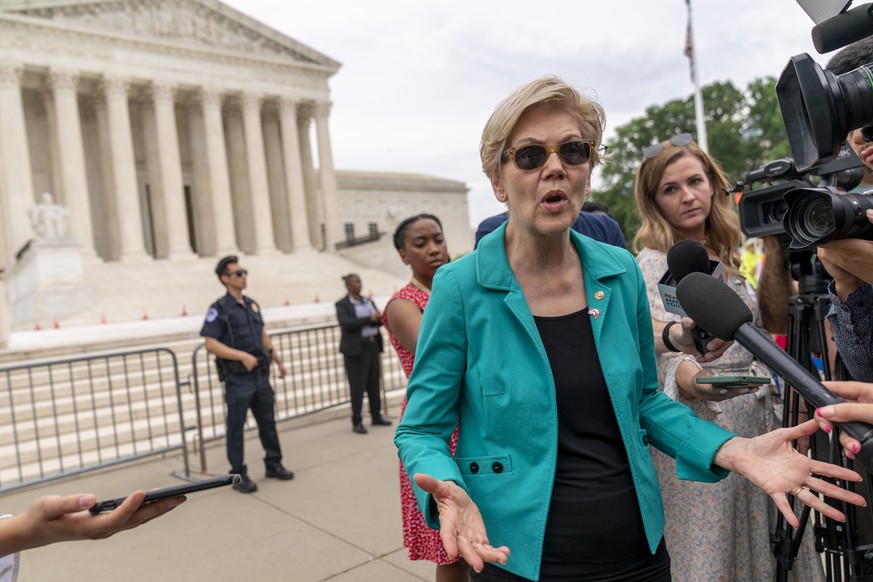 Sen. Elizabeth Warren, D-Mass., speaks to members of the media after speaking at a rally in front of the Supreme Court in Washington, Wednesday, June 9, 2021, to support the Senate&#039;s upcoming ele ...