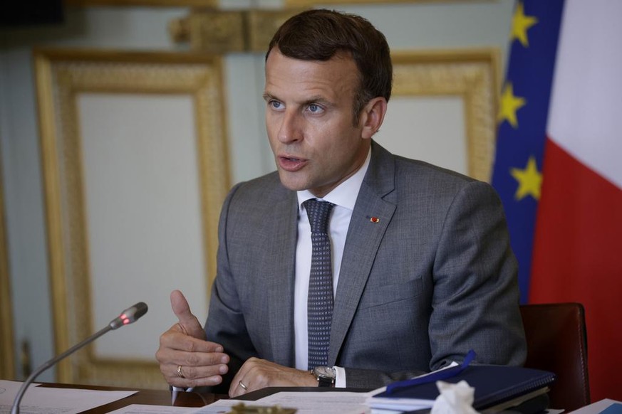 French President Emmanuel Macron gestures as he speaks during a video conference of a France-Oceania Summit at the Elysee Palace in Paris, Monday, July 19, 2021. (Yoan Valat/Pool Photo via AP)