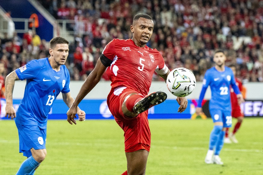 epa13279473 Switzerland's Manuel Akanji (R) and Erik Janza of Slovenia in action during the UEFA Nations League soccer match between Switzerland and Slovenia, in Lucerne, Switzerland, 03 October  ...