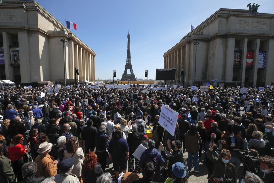 People stage a protest organized by Jewish associations, who say justice has not been done for the killing of French Jewish woman Sarah Halimi, at Trocadero Plaza near Eiffel Tower in Paris, Sunday, A ...