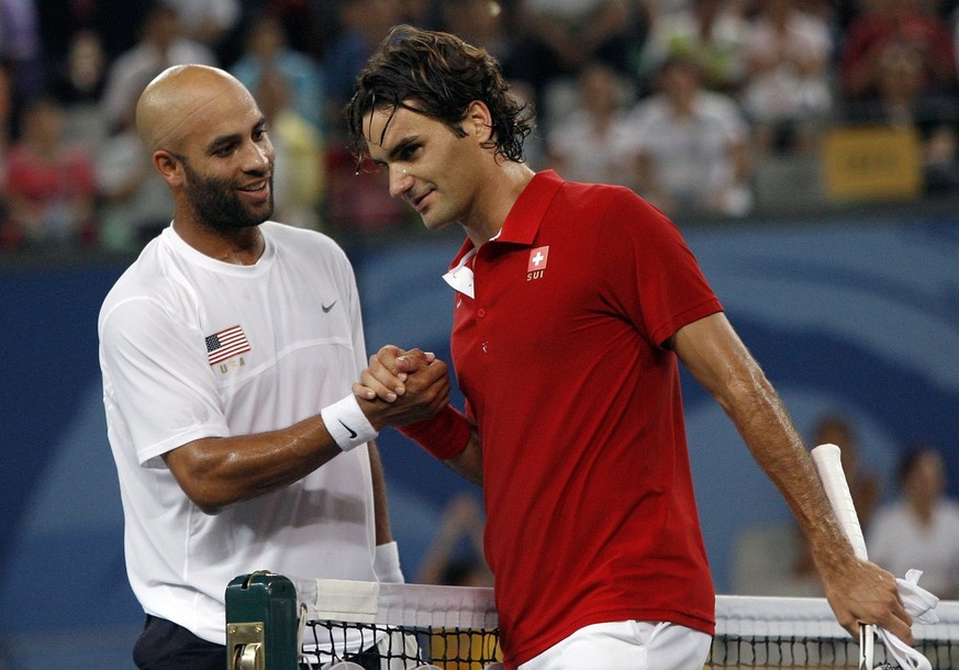 Roger Federer of Switzerland, right, and James Blake of the United States after their quarter final of the men&amp;#039;s tennis at the Beijing 2008 Olympics in Beijing, Thursday, August 14, 2008. (KE ...
