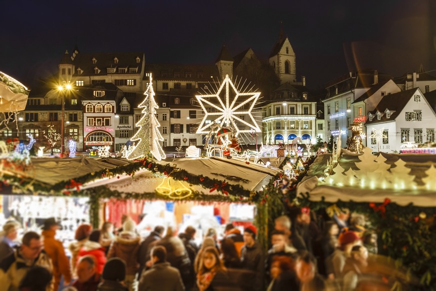 Christmas market in the old town of Basel, one of the largest and populated cities of Switzerland. It is located in the northwest of the country, on river Rhine and right on the Swiss-French-German bo ...