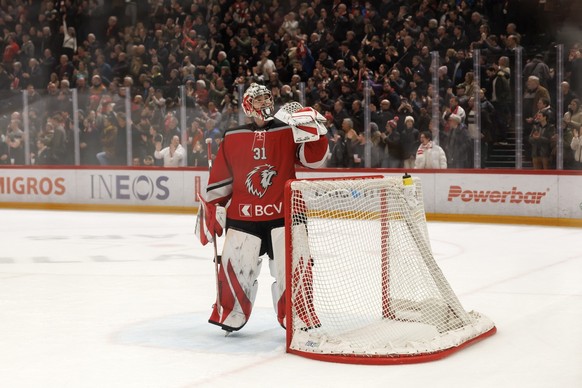 Lausanne&#039;s goaltender Connor Hughes celebrates the victory after defeating the team Geneve-Servette, during a National League regular season game of the Swiss Championship between Lausanne HC and ...