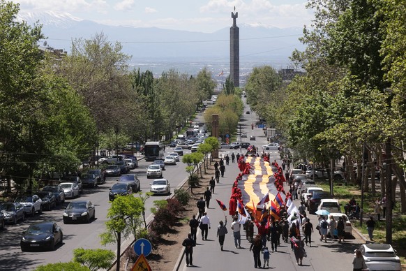 ARMENIA, YEREVAN - MAY 9, 2026: People take part in an Immortal Regiment event on Victory Day, which marks the 81st anniversary of the Victory in the Great Patriotic War the Eastern Front of WWII. The ...