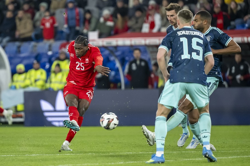 epa12855625 Switzerland's Joel Monteiro, left, scores a goal during a friendly soccer match between Switzerland and Germany at the St. Jakob-Park stadium in Basel, Switzerland, 27 March 2026. EPA ...