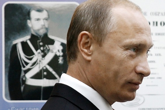 Russian Prime Minister Vladimir Putin visits the Far Eastern State University in Vladivostok, about 9,300 kilometers (some 5,750 miles) east of Moscow, on Monday, Sept. 1, 2008. A portrait of Czar Nic ...