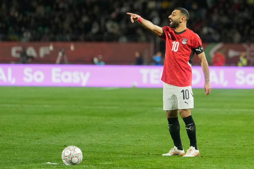 Egypt's Mohamed Salah prepares for a free kick during the Africa Cup of Nations group B soccer match between Egypt and Zimbabwe in Agadir, Morocco, Monday, Dec. 22, 2025. (AP Photo/Mosa'ab E ...