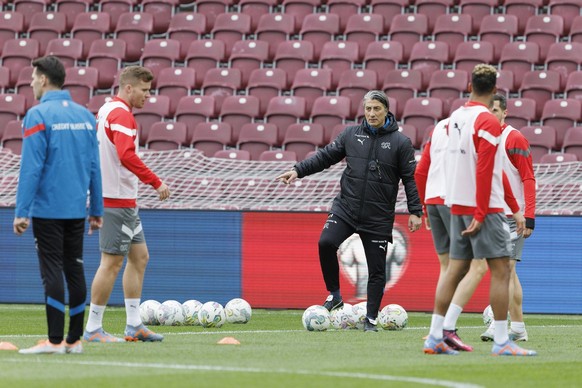 Switzerland&#039;s head coach Murat Yakin, centre, instructs his players, during a training session of the national soccer team Switzerland one day before the UEFA Euro 2024 qualifying group I soccer  ...