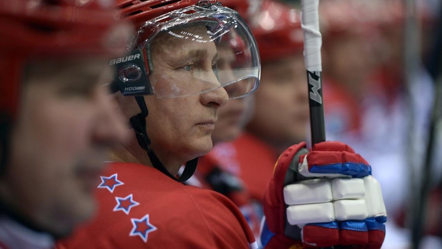 Russian President Vladimir Putin watches an exhibition hockey game at a tournament of the Night Hockey League in the Black Sea resort of Sochi, Russia, Saturday, May 16, 2015. President Vladimir Putin ...