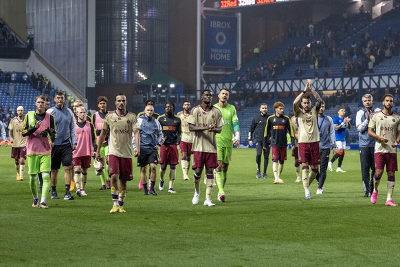 epa10792497 Servette players react to the fans after the UEFA Champions League 3rd qualifying round, 1st leg match between Glasgow Rangers and Servette in Glasgow, Britain, 09 August 2023. EPA/ROBERT  ...